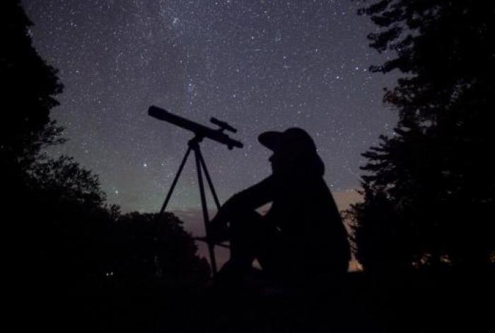 A stargazer tries to catch the Perseid Meteor Shower in 2015.