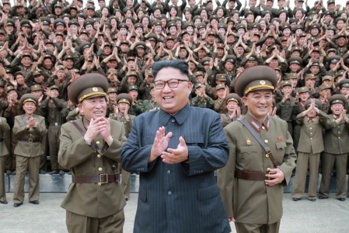 North Korean leader Kim Jong Un claps with military officers at the Command of the Strategic Force of the Korean People's Army (KPA) in an unknown location in North Korea in this undated photo released by North Korea's Korean Central News Agency (KCNA) on August 15, 2017.