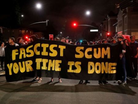 Demonstrators march in response in response to the Charlottesville, Virginia car attack on counter-protesters after the 'Unite the Right' rally organized by white nationalists, in Oakland, California, U.S., August 12, 2017.