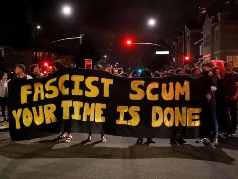 Demonstrators march in response in response to the Charlottesville, Virginia car attack on counter-protesters after the 'Unite the Right' rally organized by white nationalists, in Oakland, California, U.S., August 12, 2017.