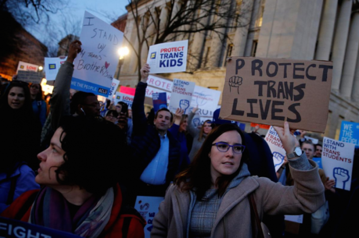 Transgender activists and supporters protest potential changes by the Trump administration in federal guidelines issued to public schools in defense of transgender student rights, near the White House in Washington, U.S. February 22, 2017.