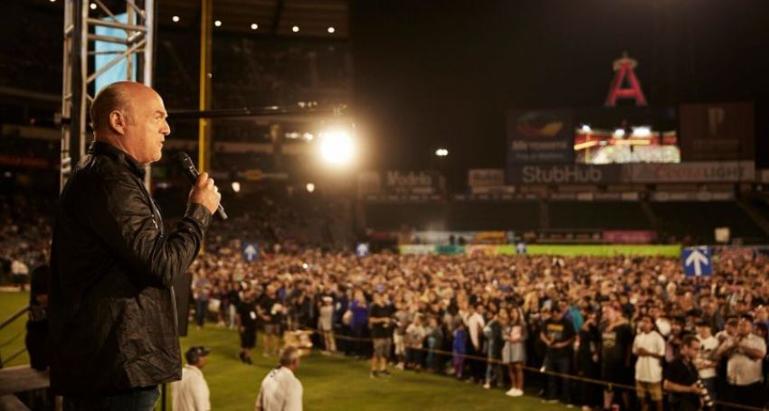 Evangelist Greg Laurie speaks to those who made "decisions for Christ" during the 28th annual SoCal Harvest at Angel Stadium in Anaheim, California on Aug. 19, 2017.
