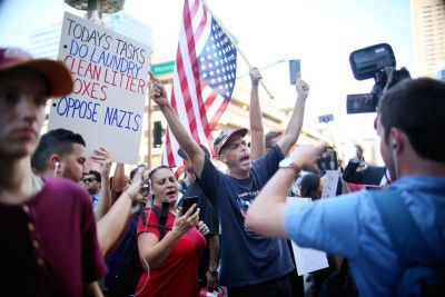 Pro Trump supporters face off with protesters outside a Donald Trump campaign rally in Phoenix, Arizona, U.S. August 22, 2017.