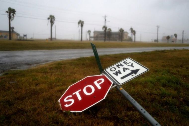 Street signs lie on the ground after winds from Hurricane Harvey escalated in Corpus Christi, Texas, U.S. August 25, 2017.