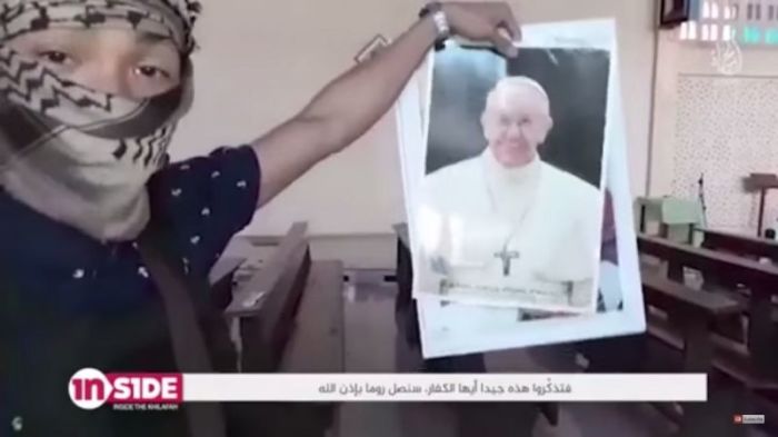 Video distributed by the pro-IS media organization Al Hayat showing a militant in the Philippines holding a photo of Pope Francis, released in August 2017.