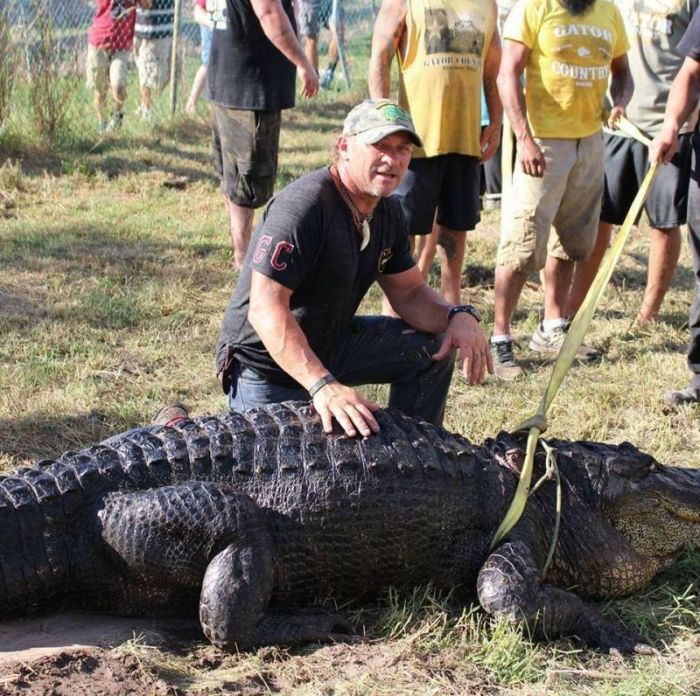 Owner of Gator Country in Beaumont, Texas, Gary Saurage and his alligator Big Tex.