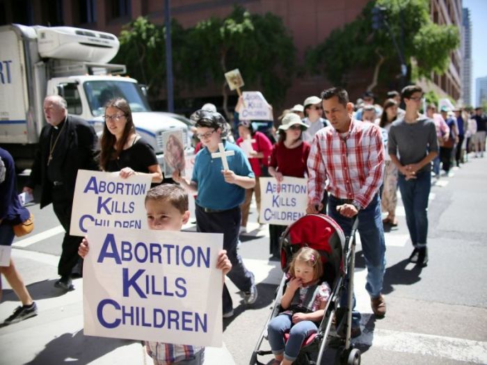 Protesters march in support of pro-life abortion legislation in front of the Federal Courthouse in San Diego, California, April 14, 2017.