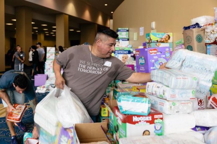 A Lakewood Church member volunteers to help the victims of Hurricane Harvey at Lakewood Church in Houston, Texas, on August 30, 2017.