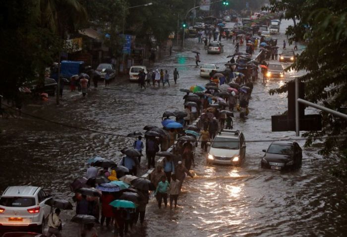 The rain briefly shut the suburban rail network on which millions of commuters depend in Mumbai, India floods in August 2017.