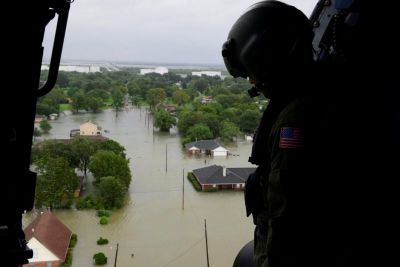 A Coast Guard helicopter searches areas hit by flood waters due to Tropical Storm Harvey in Beaumont, Texas, August 30, 2017.
