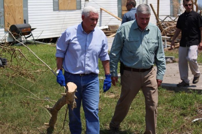 Vice President Mike Pence (L) and Samaritan's Purse President Franklin Graham visit a Samaritan's Purse relief team in Rockport, Texas, on August 31, 2017.