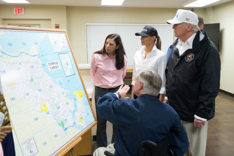 President Donald Trump and first lady Melania Trump, joined by Acting Homeland Security Secretary Elaine Duke (left), get a briefing from Texas Gov. Greg Abbott on Hurricane Harvey relief and rescue efforts in Corpus Christi, Texas, on August 29, 2017.