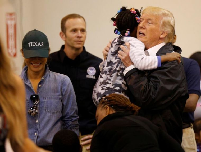 U.S. President Donald Trump and first lady Melania Trump greet children at the NRG Center where they met with flood survivors of Hurricane Harvey in Houston, Texas, September 2, 2017.