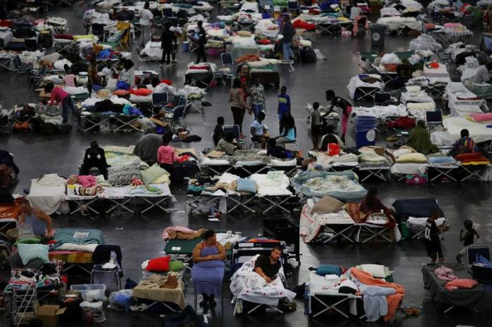 Evacuees affected by Tropical Storm Harvey take shelter at the George R. Brown Convention Center in downtown Houston, Texas, U.S. August 31, 2017.