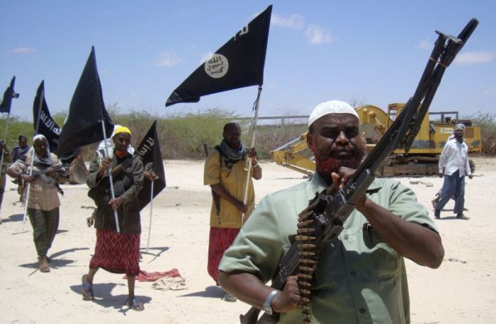Somali men parade as members of al Shabaab in the capital Mogadishu, Somalia, March 5, 2011.
