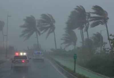 Police patrol the area as Hurricane Irma slams across islands in the northern Caribbean on Wednesday, in San Juan, Puerto Rico September 6, 2017.