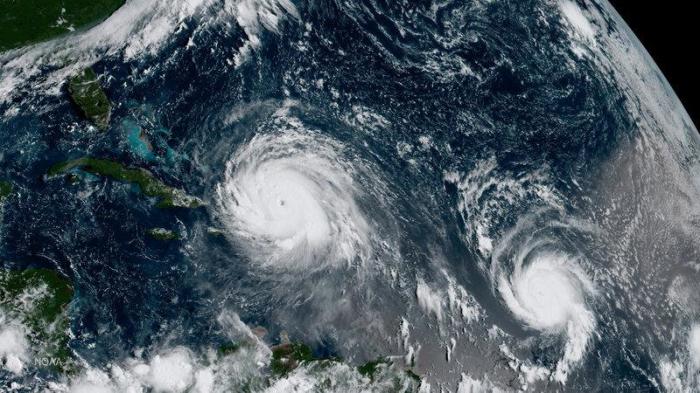 Hurricane Irma (L) and Hurricane Jose are pictured in the Atlantic Ocean in this September 7, 2017.