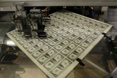 Credit : United States one dollar bills are put in packaging bands during production at the Bureau of Engraving and Printing in Washington, D.C., November 14, 2014.