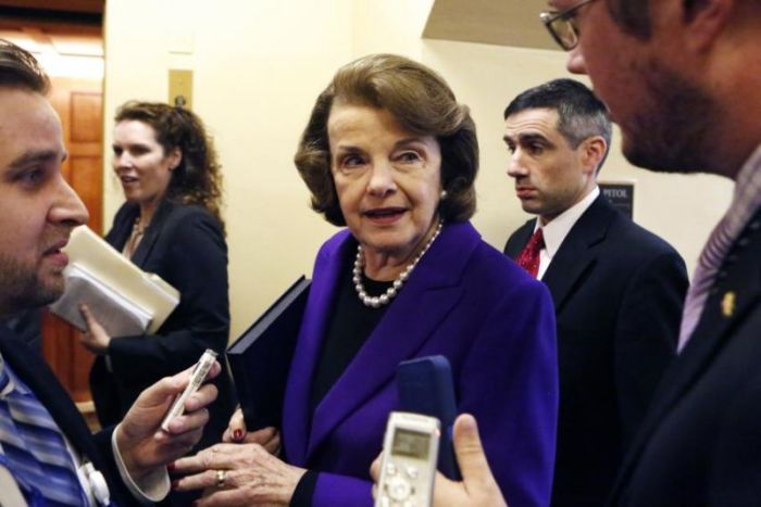 U.S. Senator Dianne Feinstein, who urged a series of policy changes to interrogation methods, talks to reporters as she walks to the Senate floor on Capitol Hill in Washington, D.C., on December 9, 2014.