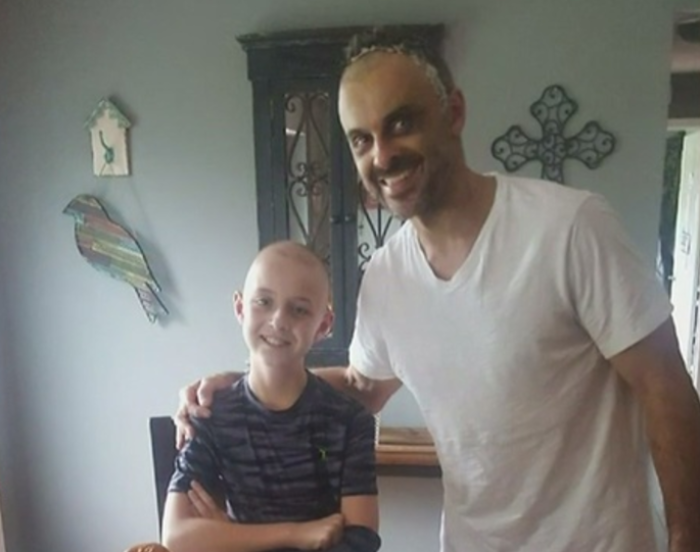 Dan Popescu, 45 (R) and his son Dylan, 11 (L) of St. Clair, Michigan, have both been diagnosed with rare brain cancers.