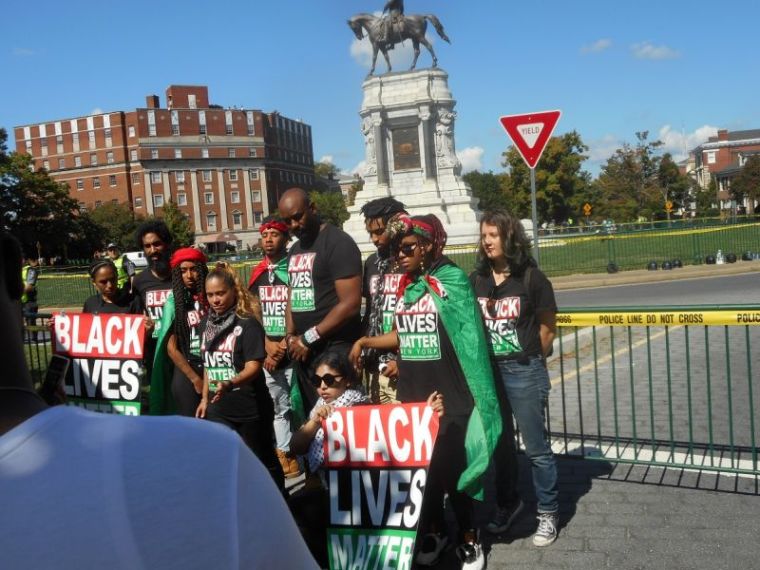 The New York chapter of Black Lives Matter join hundreds demonstrating against a Tennessee-based Confederate heritage group at the Robert E. Lee statue on Monument Avenue in Richmond, Virginia, on September 16, 2017.