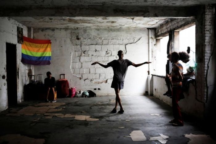 Members of lesbian, gay, bisexual and transgender (LGBT) community, that have been invited to live in a building that the roofless movement has occupied, spend time in the building, in downtown Sao Paulo, Brazil, November 3, 2016.