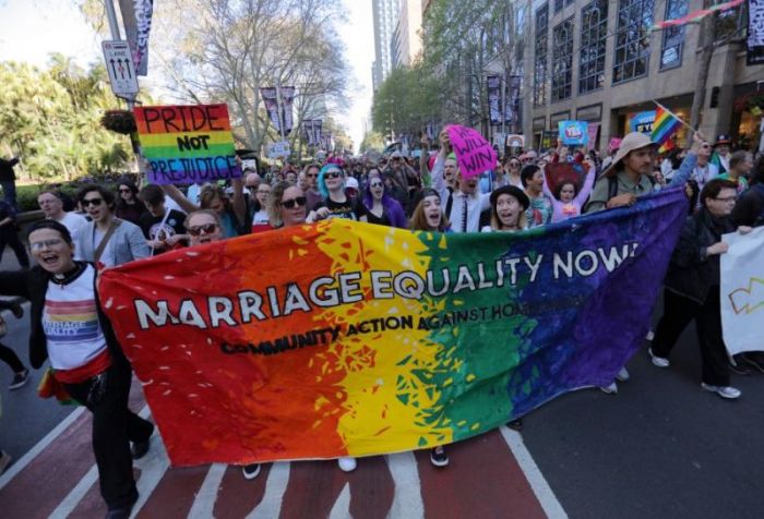 People participate in a march for marriage equality of same-sex couples in Sydney, Australia, September 10, 2017.