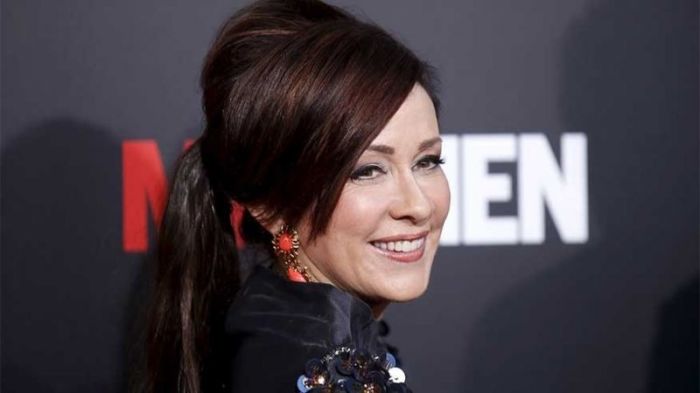 Actress Patricia Heaton poses at the 'Mad Men' Black and Red Ball to celebrate the final seven episodes of the AMC television series in Los Angeles Wednesday, March 25, 2015.