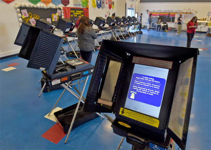 Voting machines are set up for people to cast their ballots during voting in the 2016 presidential election.