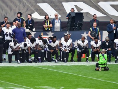 Thirteen Baltimore Ravens players kneel as the United States National Anthem is played before the game between the Jacksonville Jaguars and the Baltimore Ravens at Wembley Stadium in London, Middlesex, England on Sep 24, 2017.