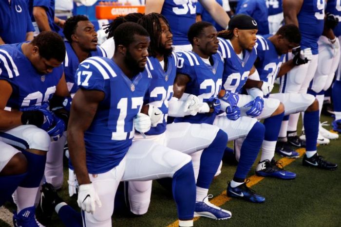 Indianapolis Colts players kneel during the playing of the U.S. national anthem before their game against the Cleveland Browns at Lucas Oil Stadium in Indianapolis, Indiana on Sep 24, 2017.