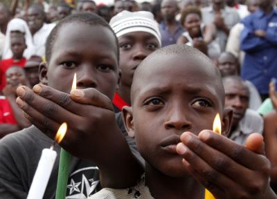 Children hold candles during a rally by Uganda's opposition parties in Masaka town, 120 km southwest of the capital Kampala in April, May 2011.