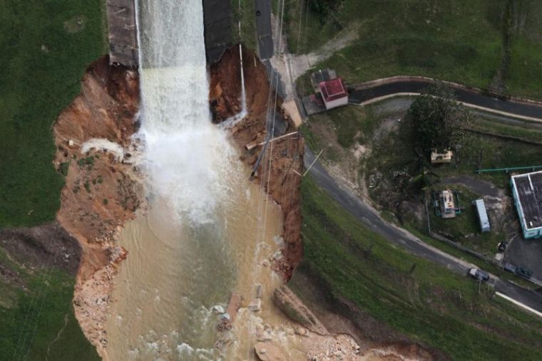 An aerial view shows the damage to the Guajataca dam in the aftermath of Hurricane Maria, in Quebradillas, Puerto Rico, September 23, 2017.