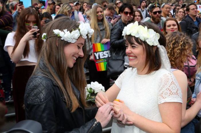 Two people participate in a mock wedding during a marriage equality march in Melbourne, Australia, August 26, 2017.