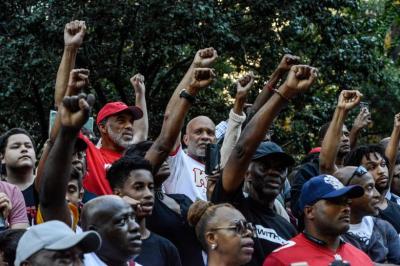 People participate in a protest against the NFL and in support of Colin Kaepernick in New York, August 23, 2017.