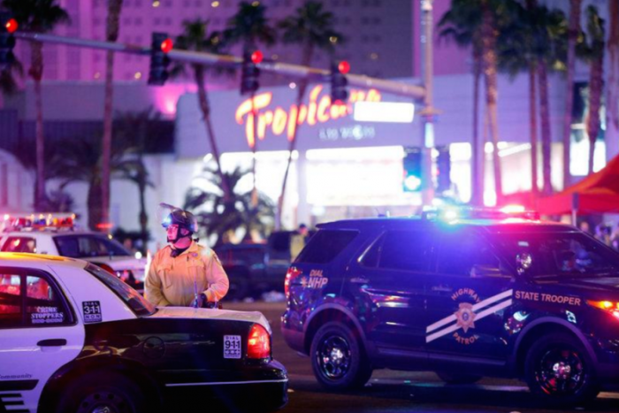 Las Vegas Metro Police officer stands by at a staging area in the intersection of Tropicana Avenue and Las Vegas Boulevard South after a mass shooting at a music festival on the Las Vegas Strip in Las Vegas, Nevada, U.S. early October 2, 2017.
