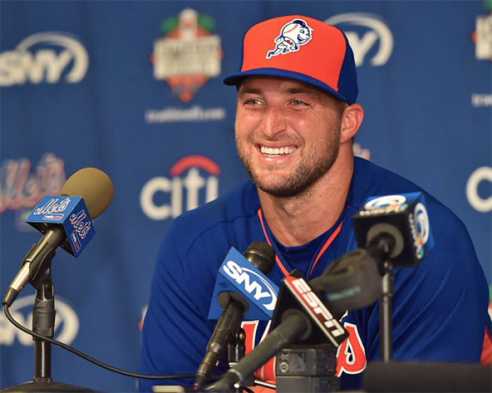 Tim Tebow speaks with the media after his workout at the Mets Minor League Complex.