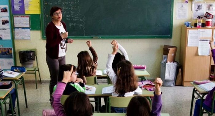 A teacher conducts a class at a public U.S. elementary school.