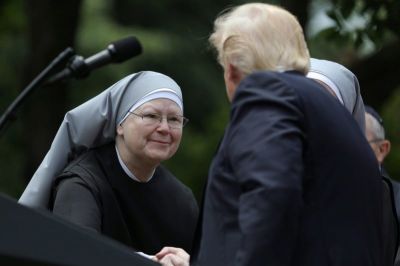 U.S. President Donald Trump shakes hands with a nun of the Little Sisters of The Poor during a National Day of Prayer event at the Rose Garden of the White House in Washington D.C., U.S., May 4, 2017.