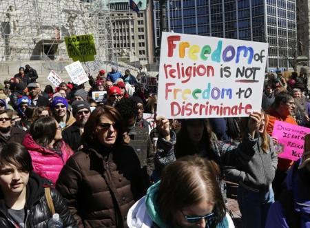 Demonstrators gather at Monument Circle to protest a controversial religious freedom bill recently signed by Governor Mike Pence during a rally in Indianapolis, Indiana, March 28, 2015.