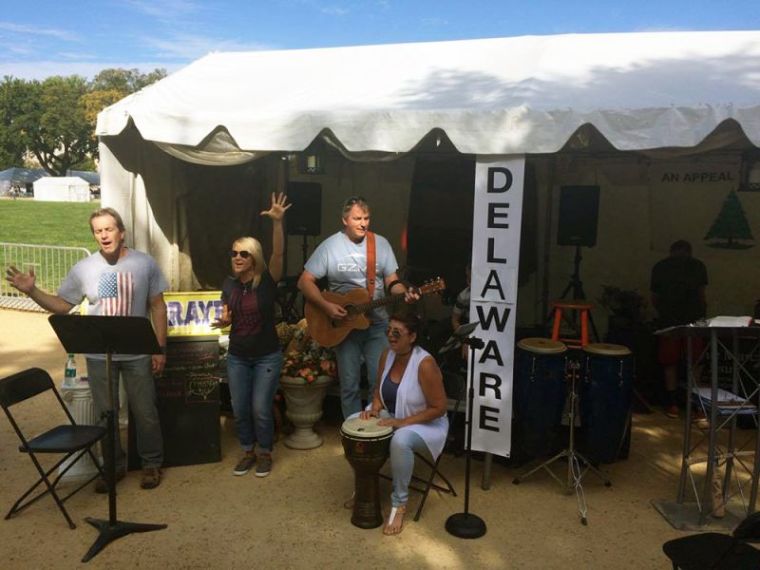 Christians sing and worship at the Delaware tent, one of 58 tent camps set up at the National Mall during the America's Tent of Meeting sponsored by Awaken the Dawn, Washington, D.C. on October 7, 2017.