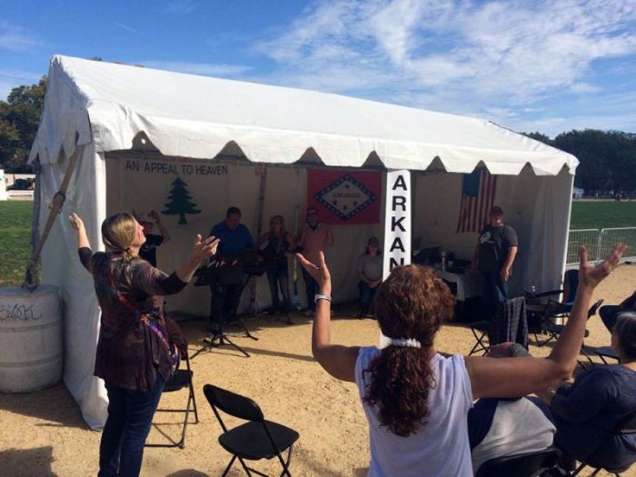 Christians sing and worship at the Arkansas tent, one of 58 tents set up at the National Mall during America's Tent of Meeting sponsored by Awaken the Dawn, Washington, D.C. on October 7, 2017.