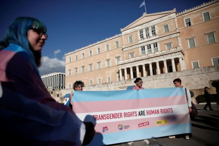 Protesters take part in a demonstration as the Greek Parliament debates bill allowing people to choose legal gender, in Athens, Greece, October 9, 2017.