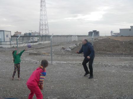 Andreas Knapp plays with children at a refugee camp in Northern Iraq in this undated photo.