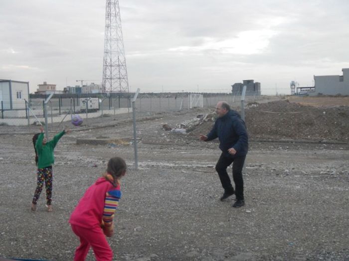 Andreas Knapp plays with children at a refugee camp in Northern Iraq in this undated photo.
