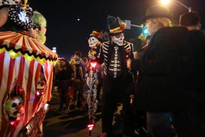 Revellers celebrate in costume at the West Hollywood Halloween Carnaval in Los Angeles.