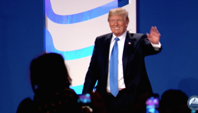 President Donald Trump waves after speaking at the Values Voter Summit in Washington, D.C., October 13, 2017.