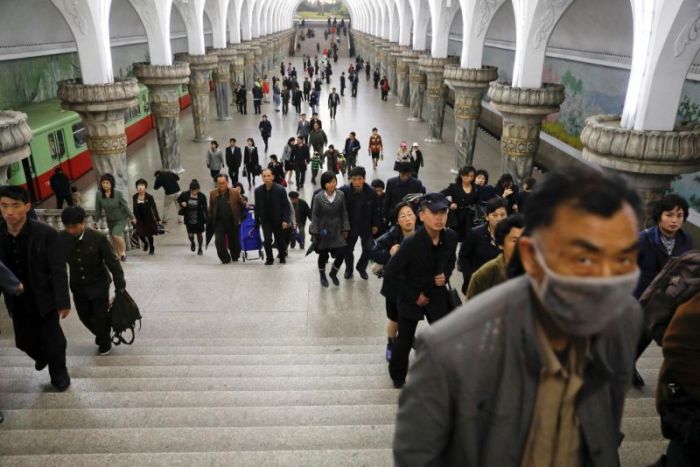 People leave a subway station visited by foreign reporters, in central Pyongyang, North Korea April 14, 2017.