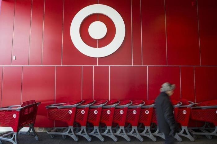 A man walks by shopping carts during the going-out-of-business sale at Target Canada in Toronto, February 5, 2015.