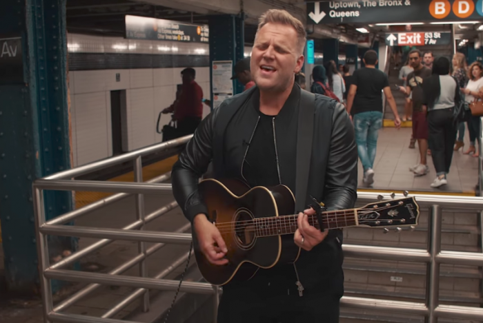 Matthew West performs his song 'Something Greater' in a New York City subway station, Oct 12, 2017.